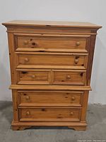 Front view of the pine dresser showing all drawers closed.