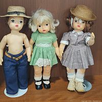 Set of three vintage Terri Lee dolls posed together showing full front view