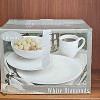 Box showing Gibson branding and White Diamonds stoneware set with plate, bowl, and mug.