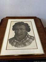 Full view of the framed lithograph depicting the Maori warrior chief Rangui with traditional tattoos, showing the entire frame and image.