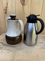 Both pitchers side by side showing color, material, and condition