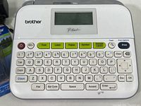 Close-up photo of Brother P-Touch PT-D400 label printer keyboard and display screen