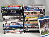 Photo showing all DVD and Blu-ray cases stacked and titles clearly visible for verification.