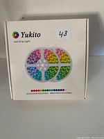 Box front showing Yukito LED Strip Light packaging with colorful LED strip spools illustration