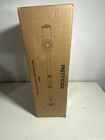 Front view of the Prettycare W400 rechargeable vacuum cleaner box with line-drawn image of the vacuum.