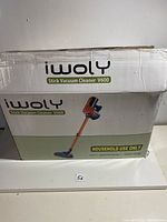 Box of Iwoly Stick Vacuum Cleaner V600 showing brand and model.