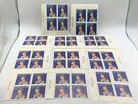 Photo showing 10 sheets each containing 4 Canadian 25 cent Queen Elizabeth II stamps from 1977, plus 1 single stamp.