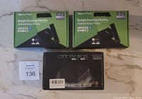 Lot showing 3 TV boxes: 2 NeonTek N12 boxes in green packaging and 1 OTT TV Box in black packaging.