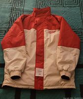 Front view of Detroit Red Wings winter jacket showing color blocking and logo placement.