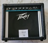 Front view of the Peavey KB15 keyboard amplifier showing the Peavey logo and overall design.