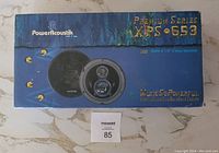 Front of box showing the speaker and Poweracoustik branding