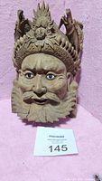 Front view of the detailed wooden carved mask showing emperor face, inlaid eyes, mustache, beard, and dragon foo dogs on the head-dress.