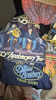 James Taylor Doobie Brothers 50th Anniversary Tour 2021 hoodie with band image and text, showing vibrant colors and good condition.