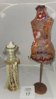 Both vintage Victorian style jewelry stands side by side, showing full height and design details