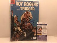 Front cover of the Roy Rogers and Trigger Dell comic book signed by Roy Rogers with JSA authenticity sticker visible in bottom right corner.