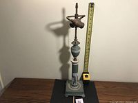 Full view of lamp with measuring tape showing height