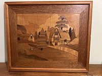 Front view of wood marquetry framed artwork showing landscape scene