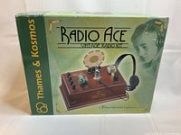 Front view of original Radio Ace box showing branding, vintage design, and image of assembled radio kit.