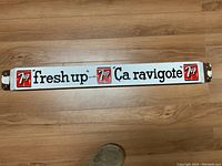 Full view of front side showing “freshup” and “Ça ravigote” text with 7UP logos