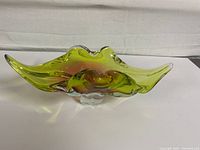 Front angle view showing shape and color gradient from amber to green, with clear base