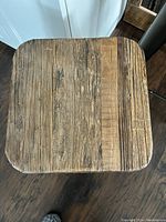 Top view of the wooden seat showing the wood grain detail and texture.