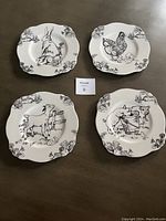 All four plates arranged showing different barnyard animal illustrations