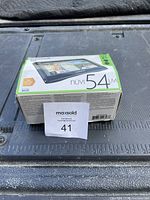Garmin nüvi 54LM displayed in unopened original box showing front and side details.