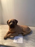 Front view of the Sandicast English Mastiff figurine showing the dog's face and body details.