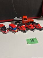 Overview of six Canadian Tire diecast collectible trucks in red and silver with logos