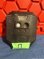 Front view of Wildgame Innovations trail camera showing dual lenses, sensor window, and logo.