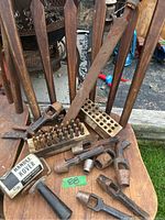 Shows overall lot including wooden case with metal letter stamps, heavy punches, Handee Kover roller, wooden handled file, and metal tools.