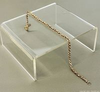 Full view of the 7.5-inch yellow gold rope chain bracelet displayed on acrylic stand