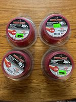 Top view of four rolls showing labels with product specs and brand name.