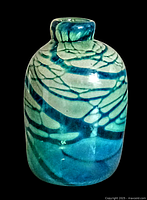 Front view of blue and green hand blown art glass vase showing swirl and crackled patterns