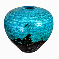 Front angle view of a rounded mid century handmade raku vase with turquoise and black glaze, showing the small top opening.