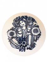 Front of the porcelain charger plate showing blue stylized woman and flower design by Björn Wiinblad.