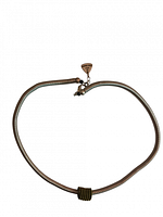 Front view of the coiled metal necklace with gold coil accent and clasp showing Sandrine Giraud signature tag