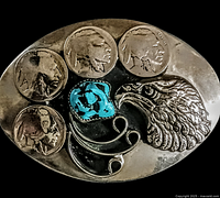 Close-up of the belt buckle front showing four buffalo nickels, turquoise stone, eagle head and swirl metal designs.