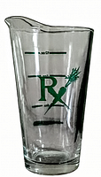 Clear glass medical measuring glass featuring green RX logo with carrot design, measuring up to 12 oz with graduated markings and a pouring spout.