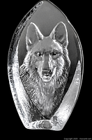 Front view of the crystal sculpture showing the detailed wolf face and shape