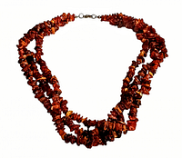 Vintage multi strand amber chip necklace, three strands, metal clasp, seen laying flat showing full necklace shape and details