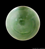 Top view of the vintage signed Nova Scotia handmade art pottery bowl showing smooth green glaze finish and circular form.
