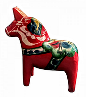 Side view of the red painted hand carved Dala horse with floral multicolor decoration