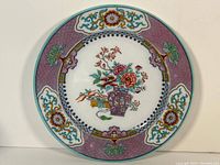 Full view of the Copeland Pekin design antique plate showing central floral and vase design with detailed border.