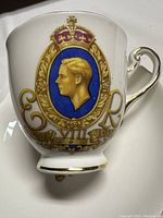 Close-up of the teacup showing Edward VIII profile, crown, gold detailing and dates 1936-1937.
