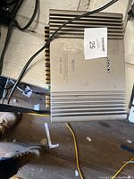 Top view of Sony XM-C1000 amplifier showing Sony branding and model number.