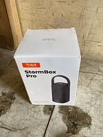 Photo of the boxed Tribit StormBox Pro portable wireless speaker in white packaging showing product image and branding.