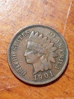 Close-up of the obverse side of the 1901 Indian Head penny showing Lady Liberty in feathered headdress and the year 1901.