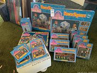 Overall view of two Town Square Play Sets, multiple lighting systems, trolleys, figure sets and central commemorative items