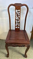Full view of the antique Chinese rosewood chair showing overall shape and design